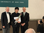 Dong Woo Shin with Binghamton University president and provost receiving his award.
