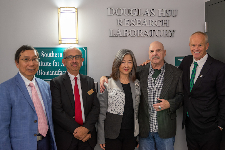 From left: Biomedical Engineering Department Chair Kaiming Ye; Watson College Dean Krishnaswami “Hari” Srihari; Connie Wong; Gary Kunis ’73, LHD ’02; and University President Harvey Stenger at the Douglas Hsu Research Laboratory dedication Oct. 16.