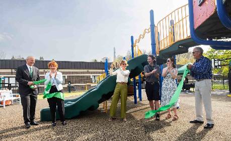 From left: Binghamton University President Harvey Stenger; Broome County Legislator and Binghamton University Foundation board member Kim Myers; Nancy Heichemer; Daniel Myers and his fiancée, Anne Glasgow; and Rick Heichemer cut the ribbon April 29 at the enhanced Social Learning Center at Binghamton University.