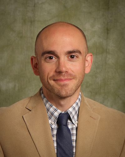 headshot of Adam Mathews