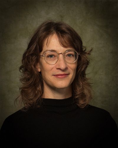 headshot of Ali  Feser