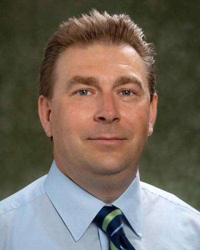headshot of Aleksey Tikhomirov