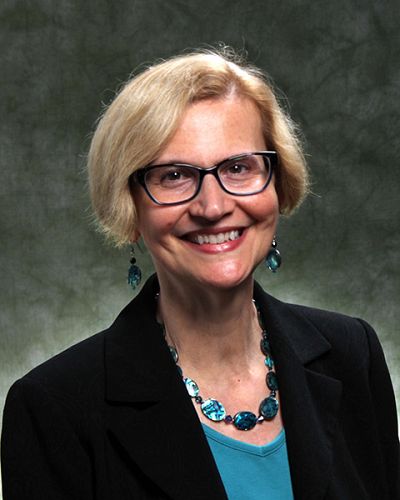 headshot of Blythe  Roveland-Brenton, Ph.D.