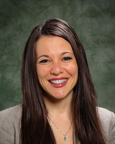 headshot of Cara Kenien-Ponomarev