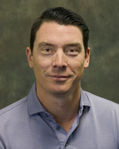 headshot of Adam Chavez