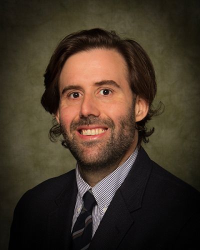 headshot of Dennis  Hogan