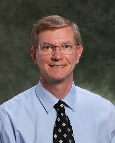 headshot of David Schuster