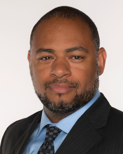 headshot of Justin  Brymn