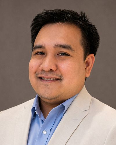 headshot of Jun Ryan Carreon