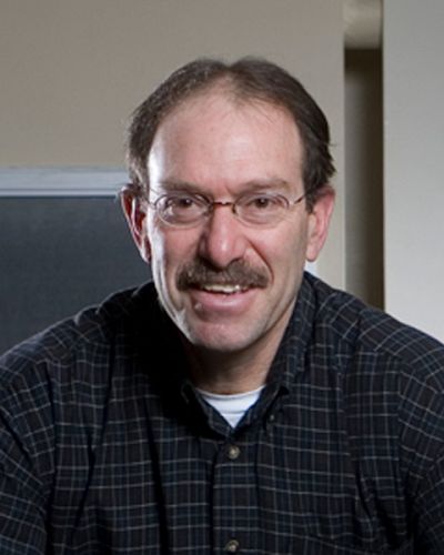 headshot of Tim Lowenstein