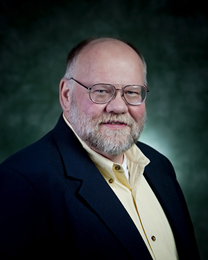 headshot of Roy T McGrann