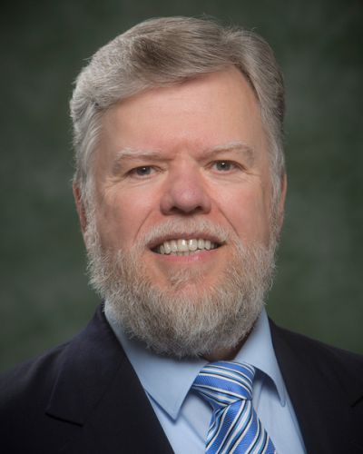 headshot of Raymond Romanczyk