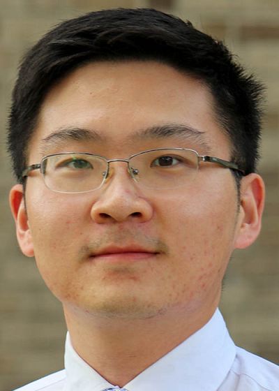 headshot of Tan Chen