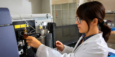 A faculty member working in a lab.
