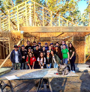 Habitat for Humanity student volunteers at a build site.