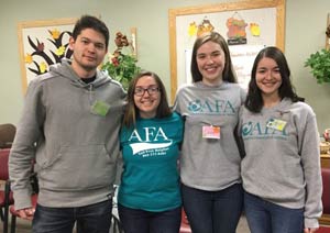 Yuto Tobin-Miyaji (left) with fellow AFA on Campus members volunteering at the Yesteryears site in Endwell, N.Y. 