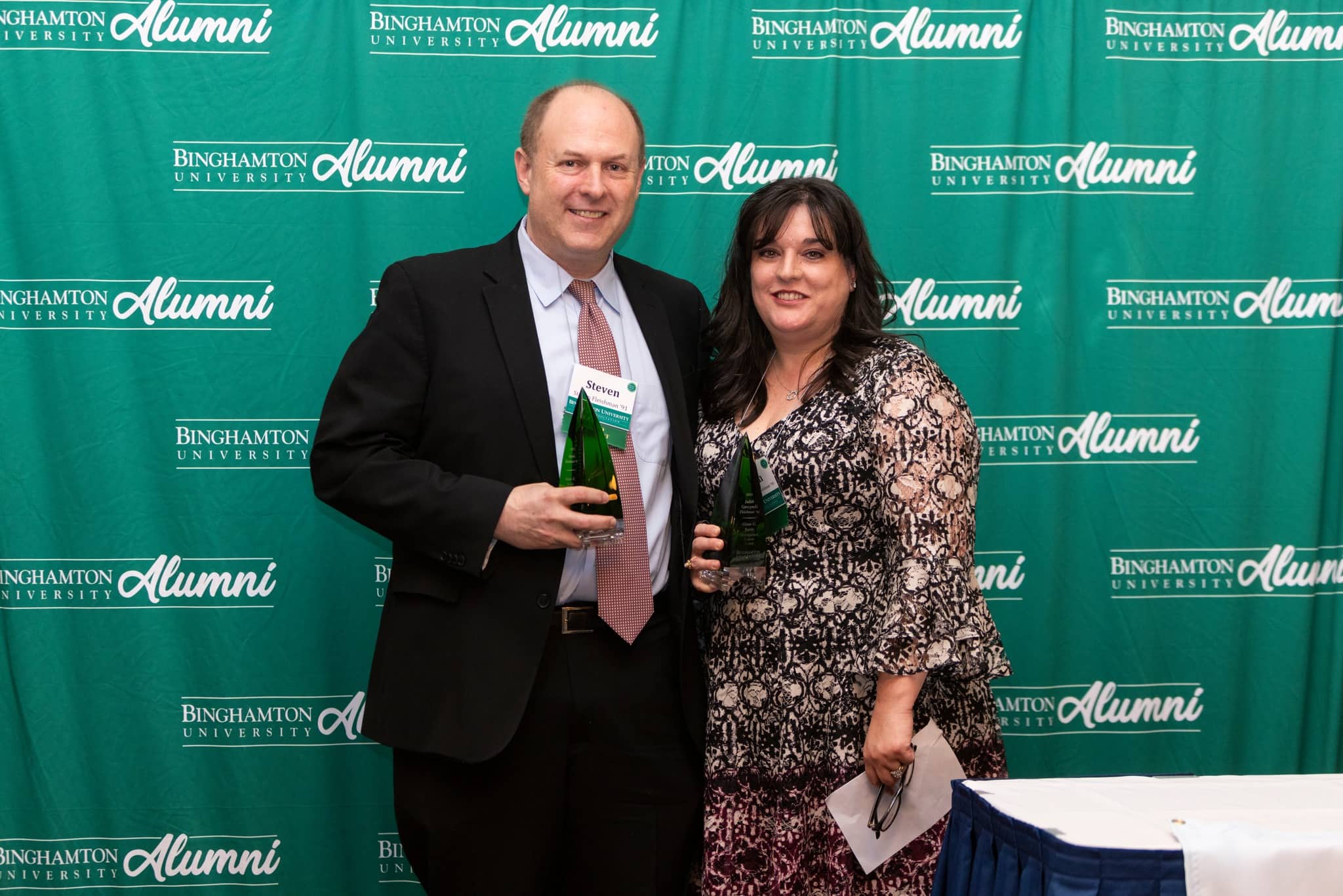 Steve Fleishman and Judith (Judy) Garczynski Fleishman holding the Glenn G. Bartle Award 
