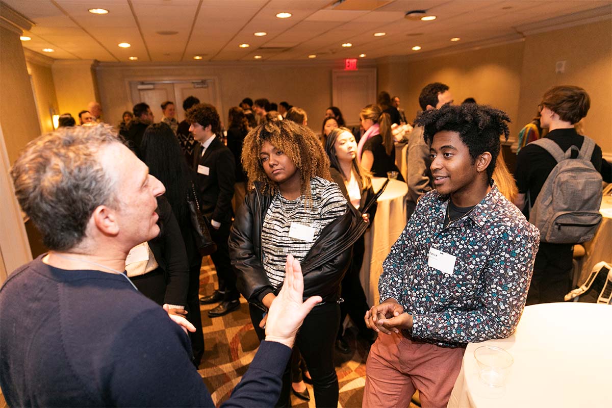 Students networking with an employer. photo