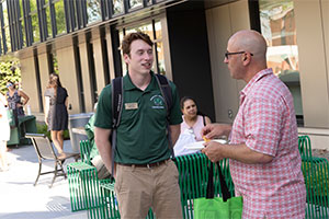 Student employee speaking with a parent. photo