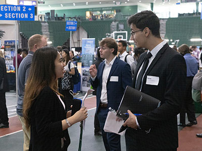 Students networking with recruiters at the job and internship fair