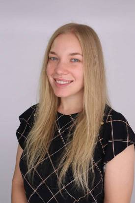 person with long blonde hair headshot