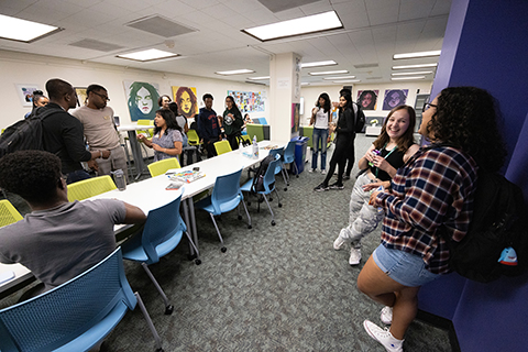 A group of students gathered in the MRC Lounge