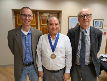 Photo of Professor CJ Zhong with Professor Grewer and Professor Lees after receiving the Distinguished Professor medal from President Stenger.
