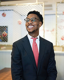 A Black male in a business suit.