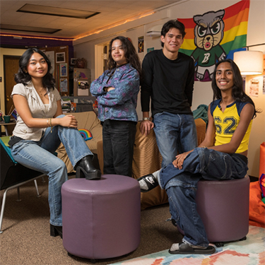 A group of diverse students pose.