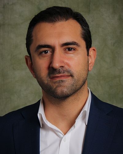 headshot of Cihan Uzmanoglu