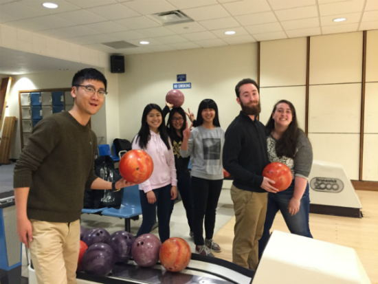 Students in the BU Conversation Pairs program bowl at the BU alley.