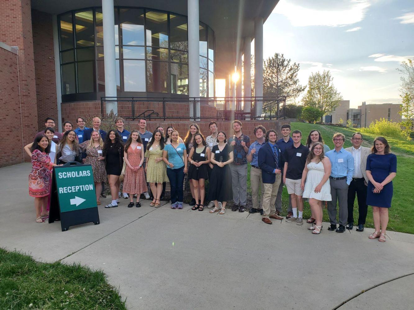 Graduating Scholars enjoy a champagne reception with President Stenger
