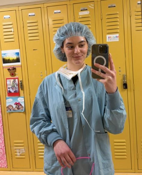 Scholar Michela Volpe prepares to scrub in for the OR as part of the Guthrie Scholars Program