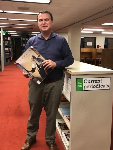 Image: Jim Galbraith, the Libraries' Head of Collection Development, poses in the Fine Arts stacks in Bartle Library