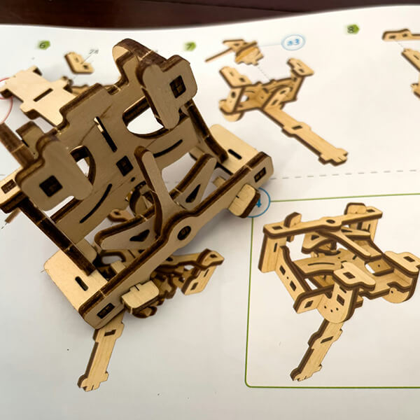 A collection of laser-cut shapes assembled into a model