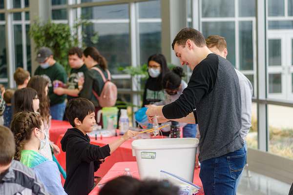 Binghamton students teach children at the STEM fair