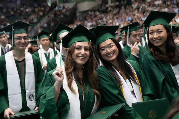 Students smiling at graduation