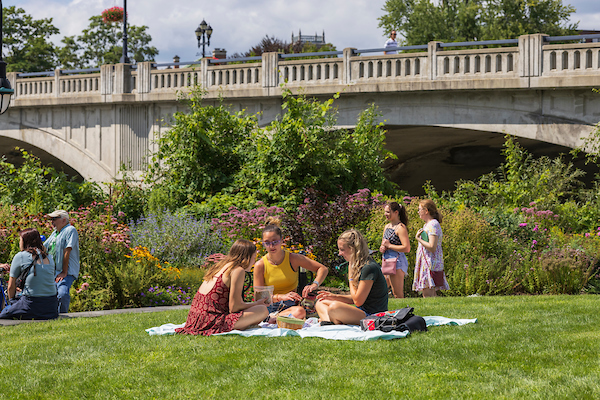 Binghamton students relax in Confluence park