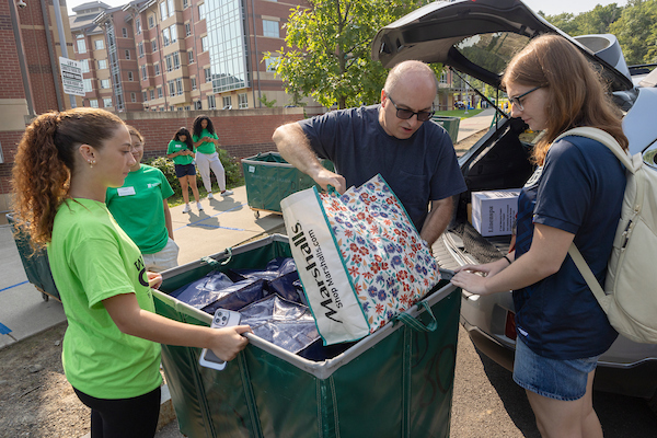 B-Welcome member helping a family pack for move-in
