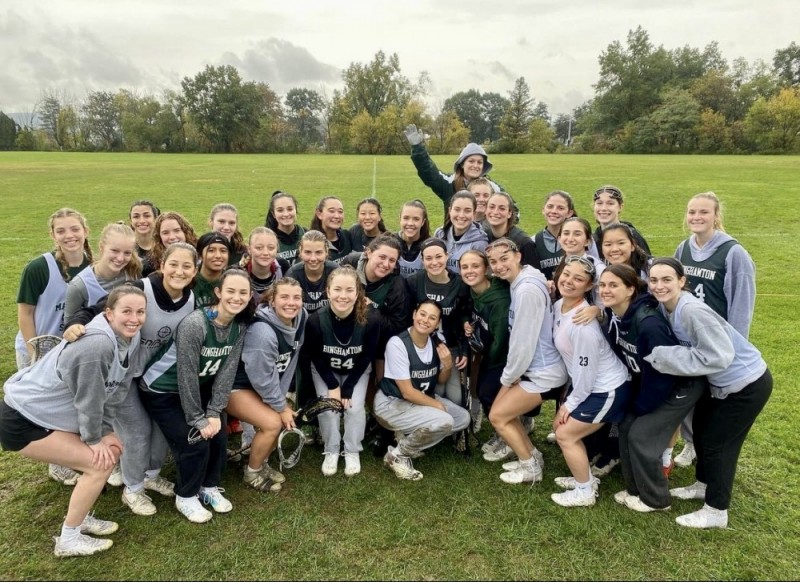 Members of the women's lacrosse team pose for a photo