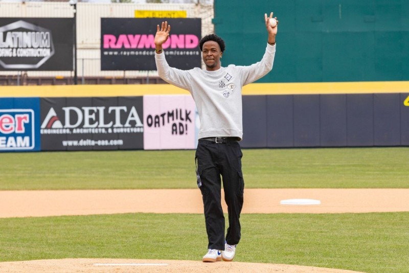 Student Busaro Robinson gets ready to pitch in the baseball field at Mirabito Stadium.