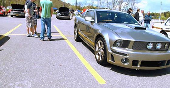 Students at a car show on campus