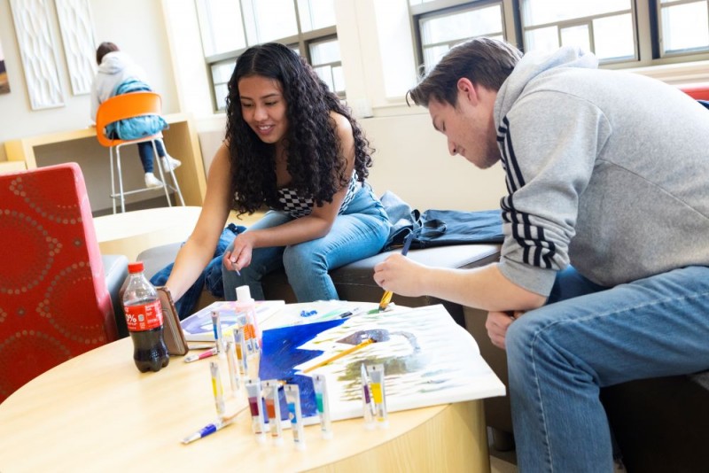 Students work on art together