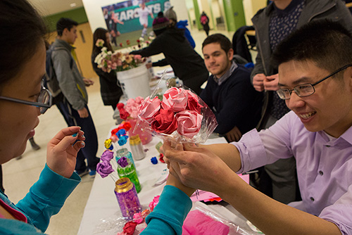 Students doing origami on campus