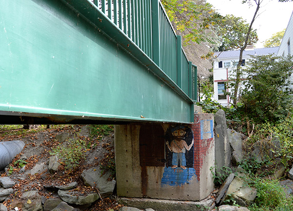 Troll painted under a bridge on campus