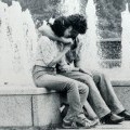 A couple at a fountain