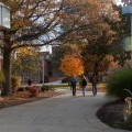 Students walking on campus in fall