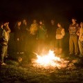 Students at a campfire on campus