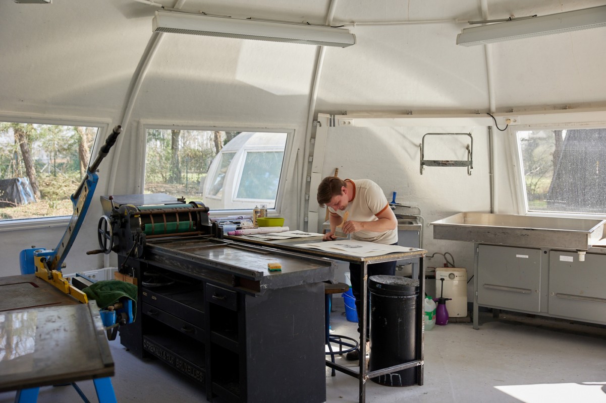 Assistant Professor of Art & Design Colin Lyons works on a project during his residency at Frans Masereel Centrum in Belgium.