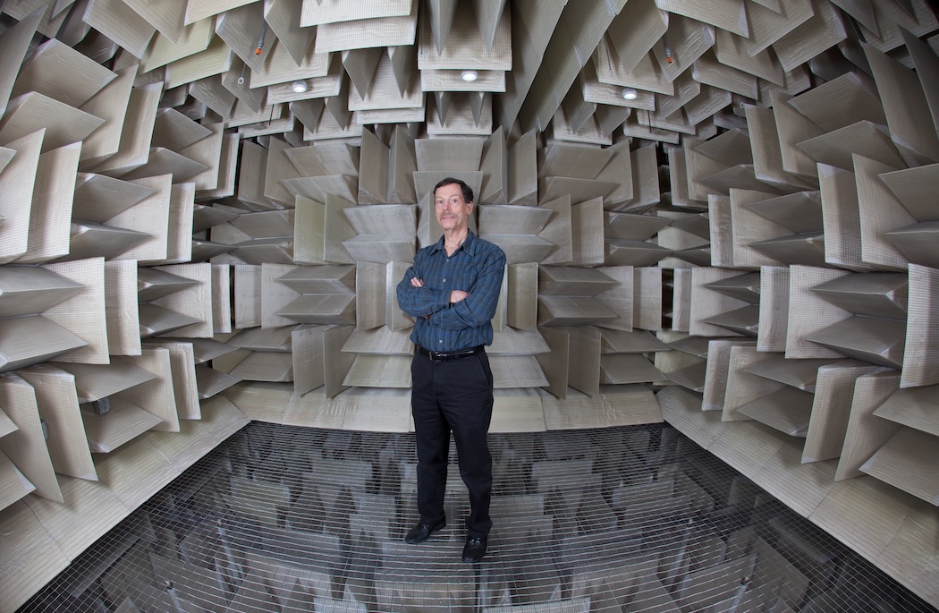 Distinguished Professor of Mechanical Engineering, Ron Miles, stands in the Anechoic Chamber.